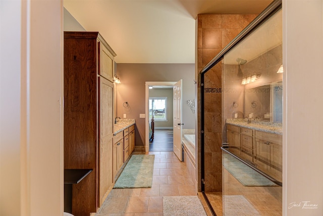 7175 Bootlegger Dr, Helena, MT 59602 - bathroom featuring two vanities, a stall shower, and a bath