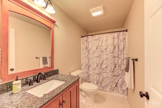 7175 Bootlegger Dr, Helena, MT 59602 - full bathroom featuring toilet, vanity, and tile patterned floors