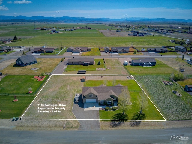 7175 Bootlegger Dr, Helena, MT 59602 - aerial overview of property's location featuring property parcel outlined and mountains