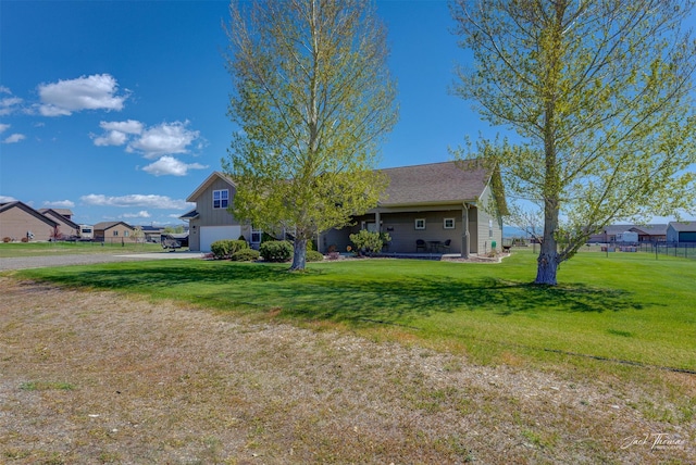 7175 Bootlegger Dr, Helena, MT 59602 - view of front of house featuring a garage, a front yard, and driveway