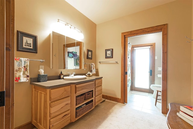 470 Salmon Way, Corvallis, MT 59828 - bathroom featuring vanity, baseboards, toilet, and tile patterned flooring