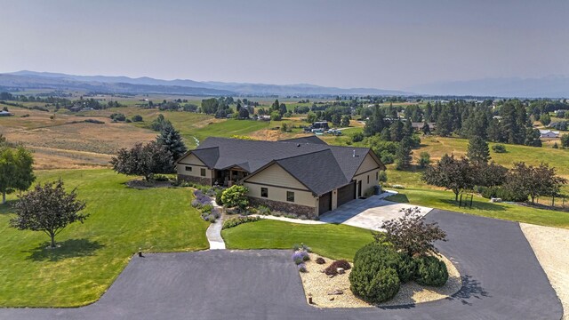 470 Salmon Way, Corvallis, MT 59828 - aerial view of property and surrounding area featuring a mountain backdrop
