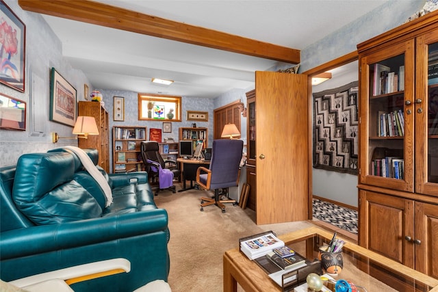 carpeted office with wallpapered walls and beam ceiling