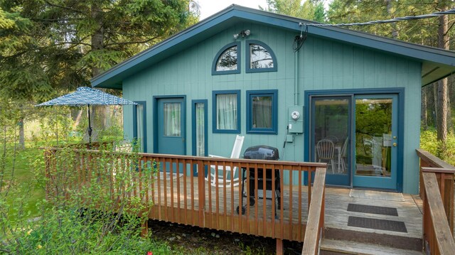 back of house featuring a deck