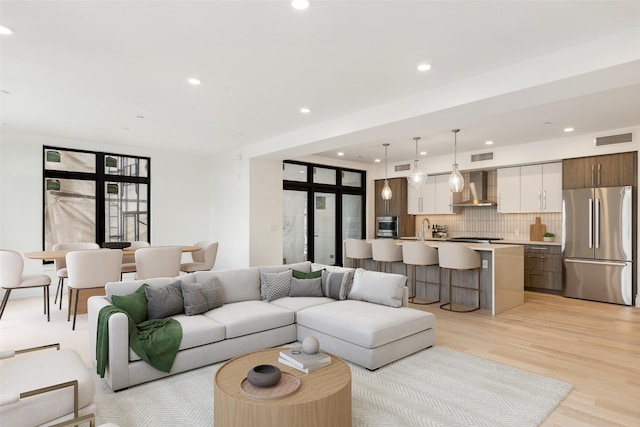315 N Tracy Ave Unit 404, Bozeman, MT 59715 - living area with light wood-style flooring and recessed lighting