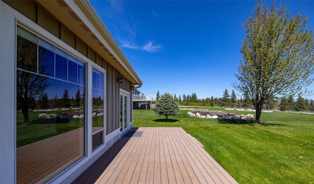 125 Schlegel View Rd, Kalispell, MT 59901 - wooden deck featuring a lawn