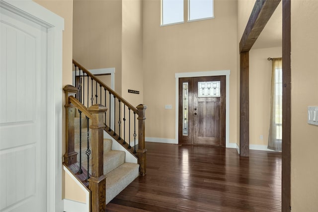 125 Schlegel View Rd, Kalispell, MT 59901 - foyer entrance with wood-type flooring, a towering ceiling, and stairs