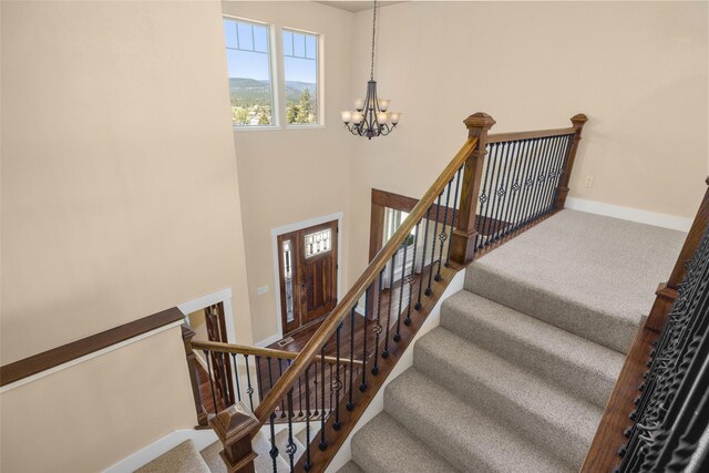 125 Schlegel View Rd, Kalispell, MT 59901 - stairs with a chandelier and carpet floors
