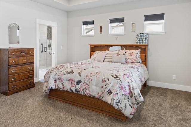 131 Owl Loop, Kalispell, MT 59901 - carpeted bedroom with multiple windows and ensuite bath
