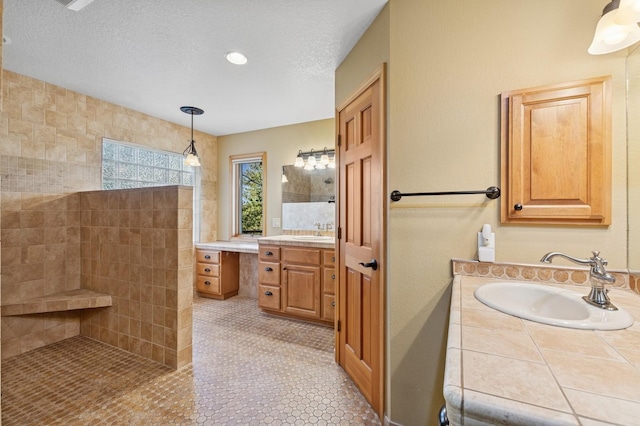 240 Eagle Bend Dr, Bigfork, MT 59911 - bathroom with vanity, walk in shower, tile patterned floors, and a textured ceiling