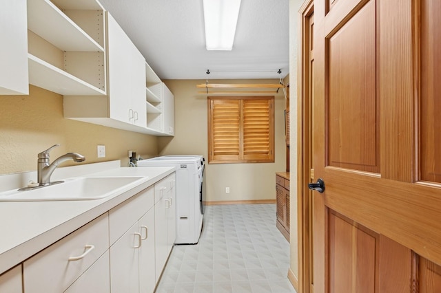 240 Eagle Bend Dr, Bigfork, MT 59911 - laundry room with light floors, washer and dryer, and cabinet space