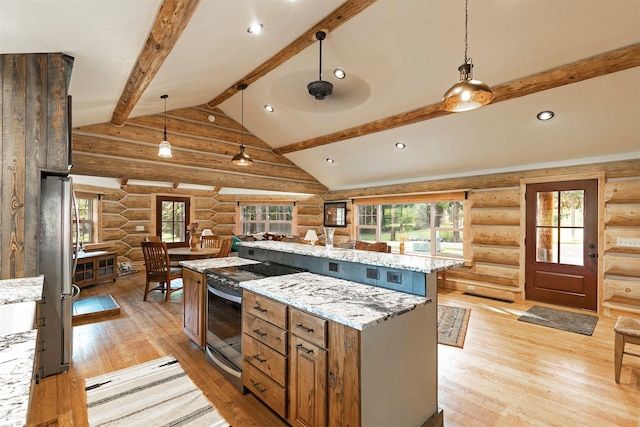 kitchen with rustic walls, appliances with stainless steel finishes, light wood-style floors, pendant lighting, and light stone counters