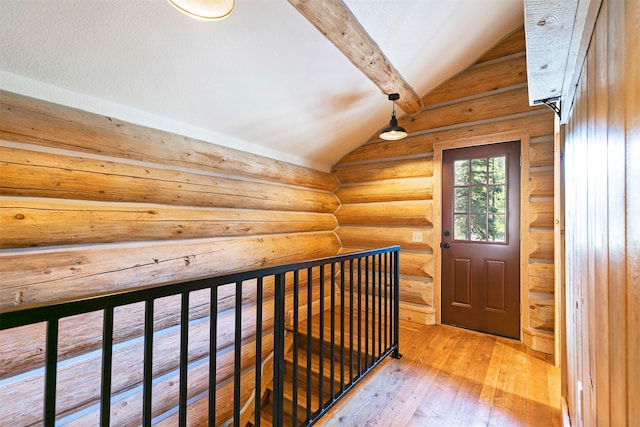 4991 Petty Creek Rd, Alberton, MT 59820 - hallway with rustic walls, wood-type flooring, and an upstairs landing