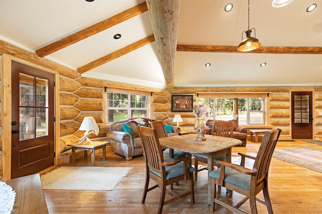 dining area with rustic walls, healthy amount of natural light, light wood finished floors, and recessed lighting