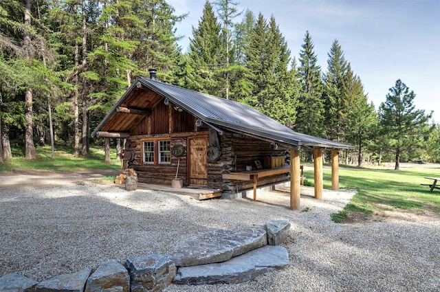 surrounding community with an outbuilding and a wooded view