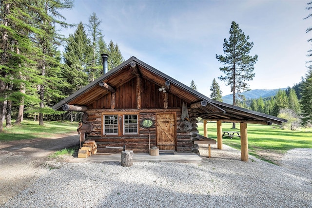 4991 Petty Creek Rd, Alberton, MT 59820 - log-style house with log exterior and a mountain view