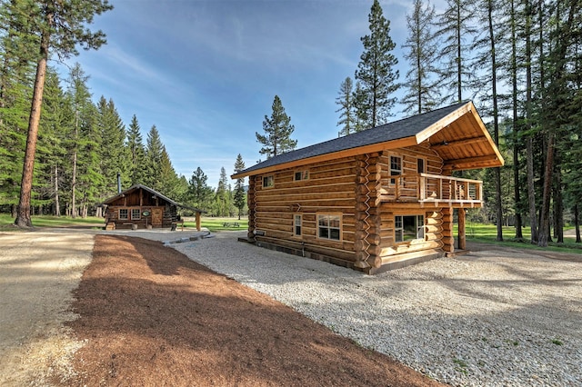 4991 Petty Creek Rd, Alberton, MT 59820 - view of property exterior featuring log exterior and gravel driveway