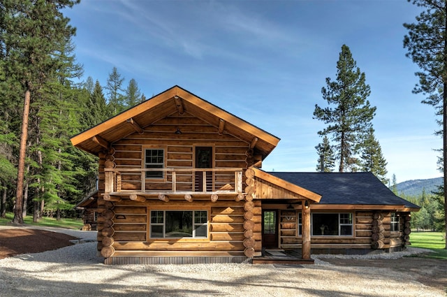 log home featuring log siding