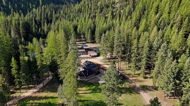 view of subject property featuring a forest