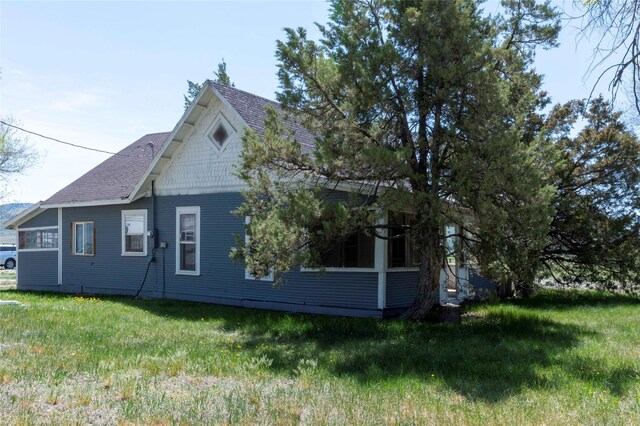 4 Ratcliff Rd, Hot Springs, MT 59845 - view of property exterior featuring roof with shingles and a yard