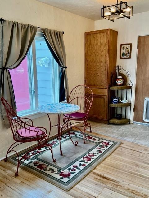 915 Hauser Blvd, Helena, MT 59601 - dining space with light wood-style floors, a chandelier, and baseboards