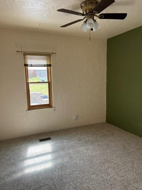 915 Hauser Blvd, Helena, MT 59601 - carpeted empty room with a ceiling fan