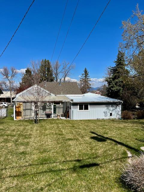 915 Hauser Blvd, Helena, MT 59601 - back of house with a lawn