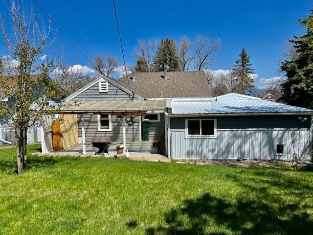 915 Hauser Blvd, Helena, MT 59601 - back of house with a yard, metal roof, and a patio