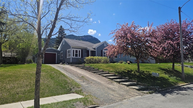 915 Hauser Blvd, Helena, MT 59601 - view of front of property featuring dirt driveway, an outdoor structure, a front lawn, and a detached garage