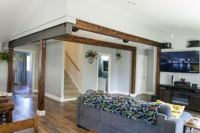 179 Fairmont Rd, Kalispell, MT 59901 - living area with wood finished floors, stairs, baseboards, and lofted ceiling