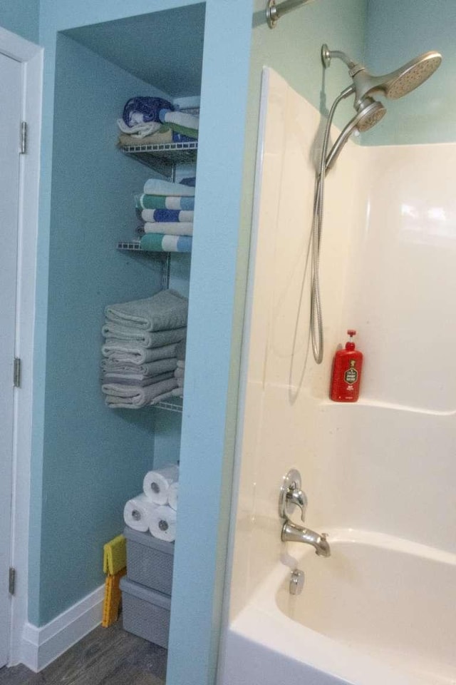 179 Fairmont Rd, Kalispell, MT 59901 - full bathroom featuring bathing tub / shower combination and baseboards
