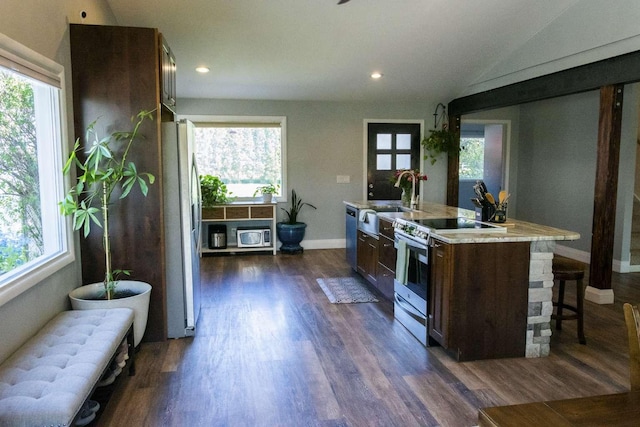 179 Fairmont Rd, Kalispell, MT 59901 - kitchen featuring stainless steel appliances, a sink, baseboards, light countertops, and dark wood-style floors