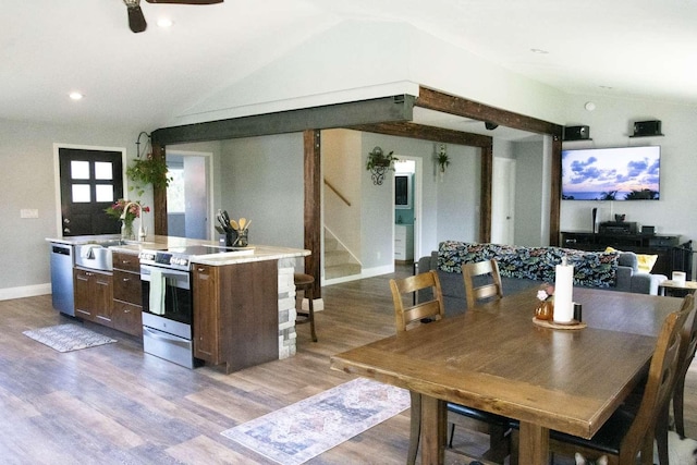 179 Fairmont Rd, Kalispell, MT 59901 - kitchen with appliances with stainless steel finishes, lofted ceiling, light countertops, wood finished floors, and a sink