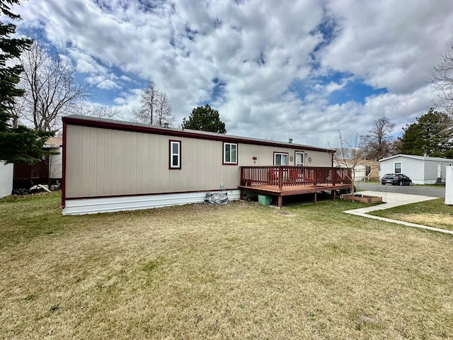 3000 Villard Ave Unit 80, Helena, MT 59601 - rear view of property featuring a wooden deck and a yard