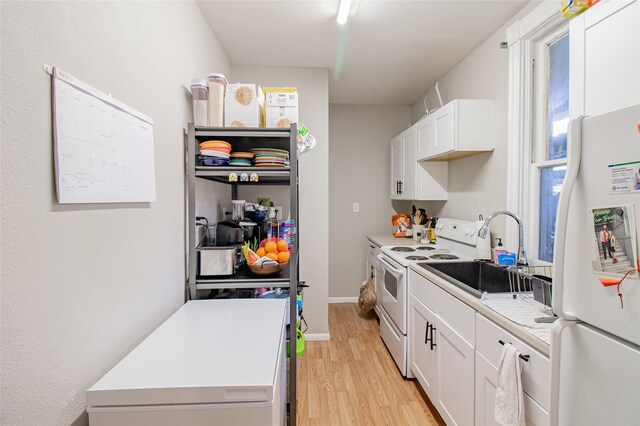 717 W Quartz St, Butte, MT 59701 - kitchen with white appliances, a sink, light wood-style floors, and white cabinets