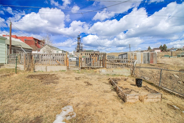 717 W Quartz St, Butte, MT 59701 - view of yard featuring a gate, a garden, and fence