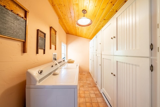 102 Scenery Rd, Libby, MT 59923 - clothes washing area featuring washer and dryer, cabinet space, wood ceiling, and a baseboard heating unit