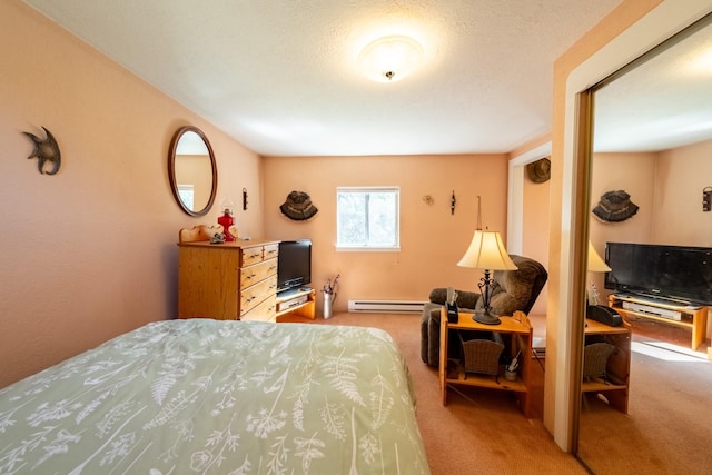 102 Scenery Rd, Libby, MT 59923 - carpeted bedroom featuring a baseboard heating unit