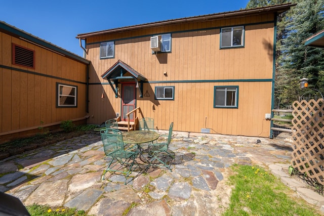 102 Scenery Rd, Libby, MT 59923 - rear view of house with a patio and entry steps