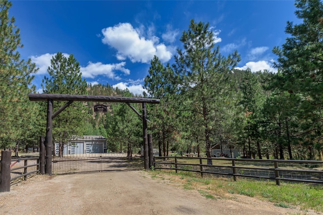 10758 Sleeman Creek Rd, Lolo, MT 59847 - view of dirt / gravel road featuring a gate and a gated entry