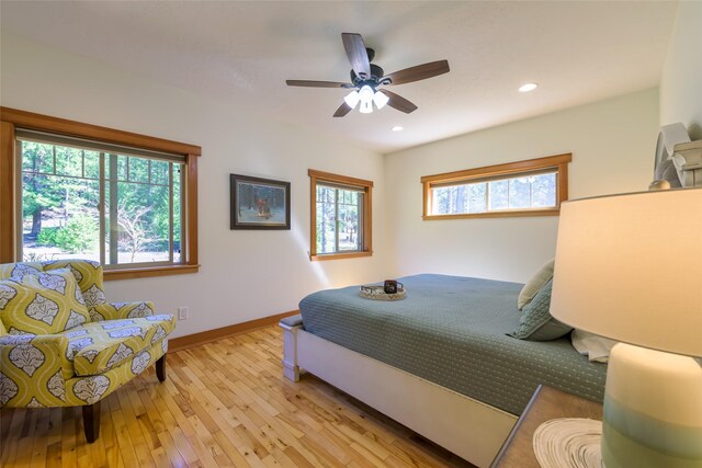 10758 Sleeman Creek Rd, Lolo, MT 59847 - bedroom featuring light wood-style floors, recessed lighting, and a ceiling fan