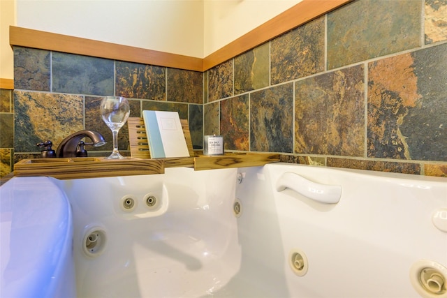 10758 Sleeman Creek Rd, Lolo, MT 59847 - bathroom view of decorative backsplash and a jetted tub