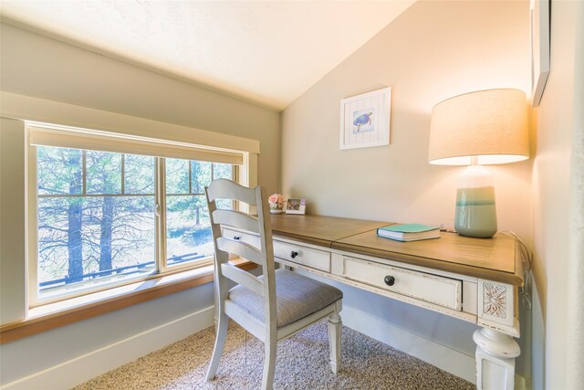 10758 Sleeman Creek Rd, Lolo, MT 59847 - carpeted home office with vaulted ceiling and baseboards