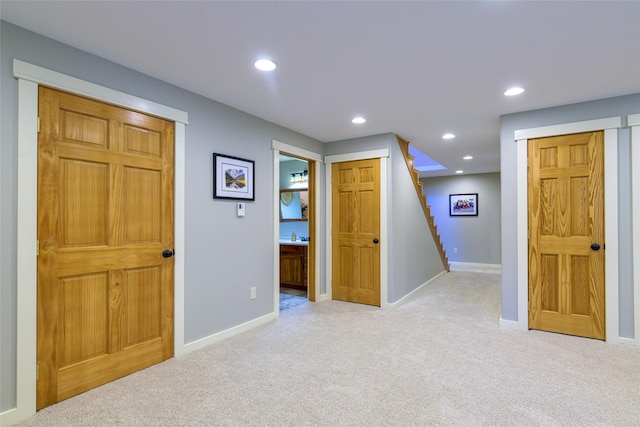 10758 Sleeman Creek Rd, Lolo, MT 59847 - hallway with light colored carpet and recessed lighting