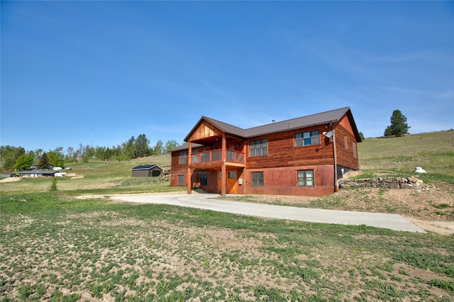 668 Dry Gulch Rd, Stevensville, MT 59870 - back of house with a yard and a balcony