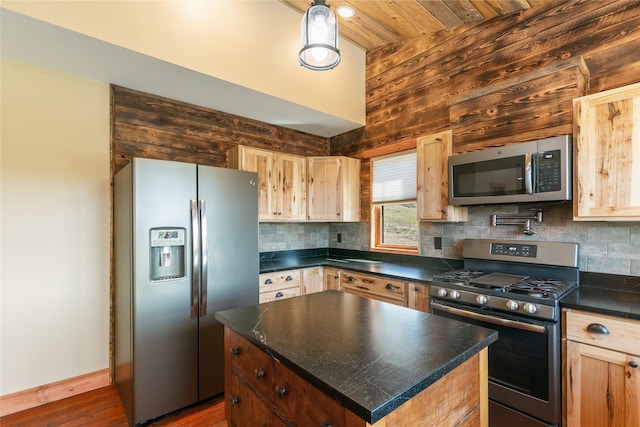 668 Dry Gulch Rd, Stevensville, MT 59870 - kitchen featuring appliances with stainless steel finishes, dark countertops, backsplash, light brown cabinetry, and wood ceiling