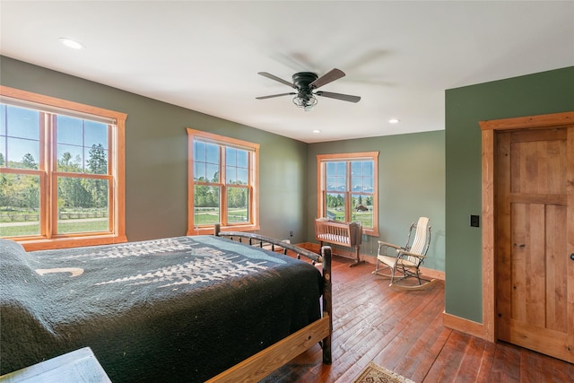 668 Dry Gulch Rd, Stevensville, MT 59870 - bedroom with baseboards, hardwood / wood-style floors, recessed lighting, and ceiling fan