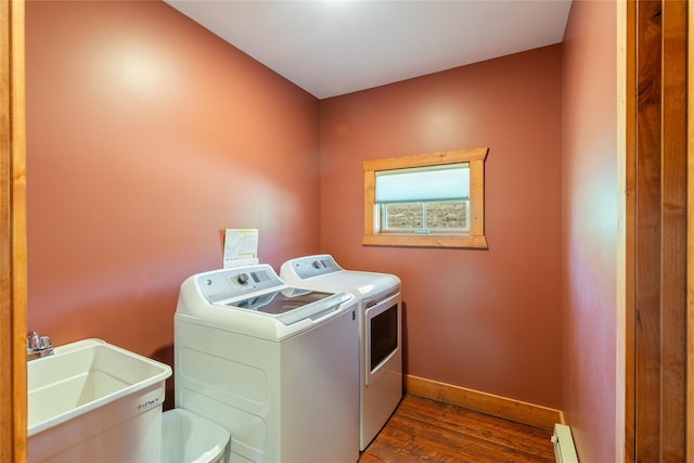668 Dry Gulch Rd, Stevensville, MT 59870 - washroom with separate washer and dryer, dark wood finished floors, baseboards, and a baseboard radiator