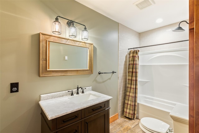 668 Dry Gulch Rd, Stevensville, MT 59870 - full bath with toilet, shower / bath combo, vanity, baseboards, and wood finished floors