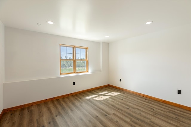 668 Dry Gulch Rd, Stevensville, MT 59870 - unfurnished room with baseboards, wood finished floors, and recessed lighting